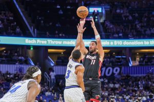 Klay Thompson shooting a three-pointer for the Heat in preseason
