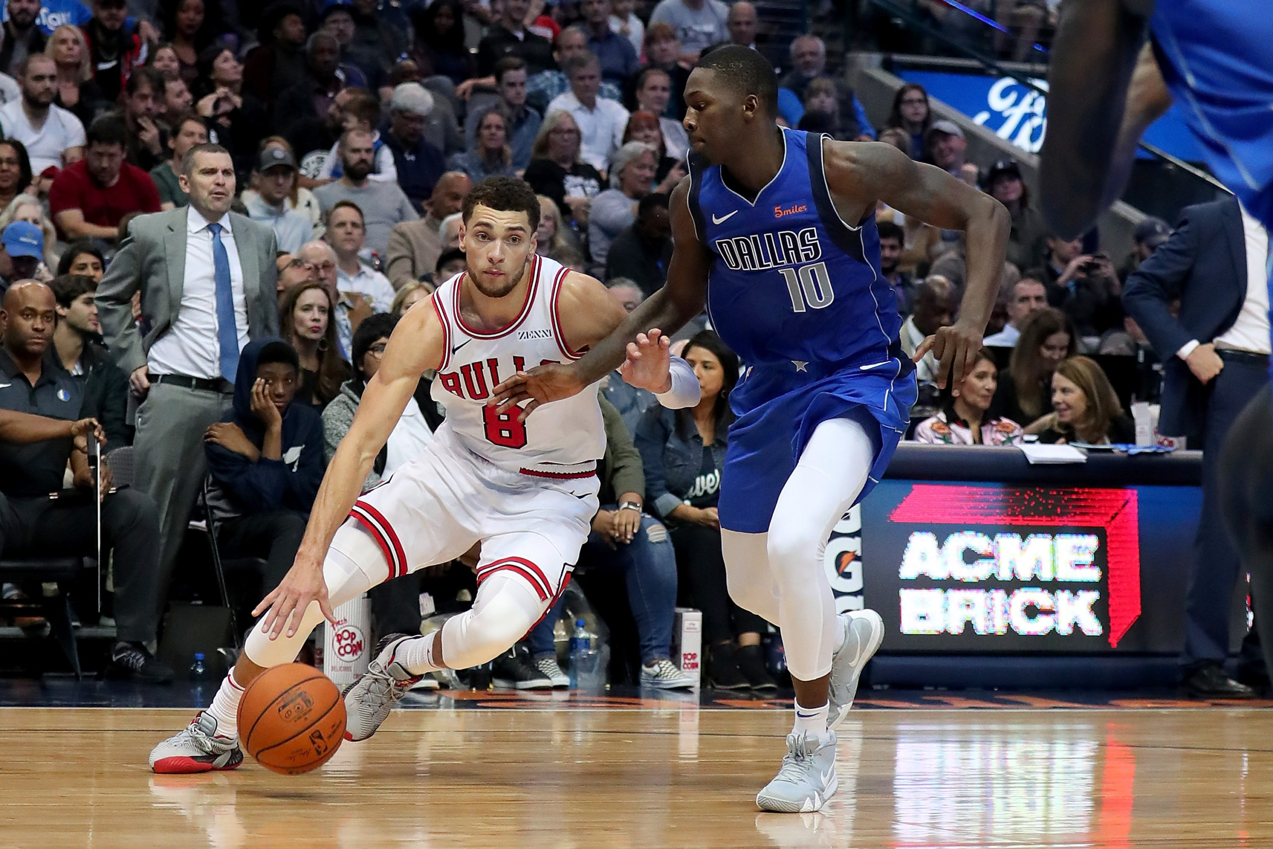 DALLAS, TX - OCTOBER 22: Zach LaVine #8 of the Chicago Bulls drives to the basket against Dorian Finney-Smith #10 of the Dallas Mavericks in the second half at American Airlines Center on October 22, 2018 in Dallas, Texas. NOTE TO USER: User expressly acknowledges and agrees that, by downloading and or using this photograph, User is consenting to the terms and conditions of the Getty Images License Agreement. (Photo by Tom Pennington/Getty Images)