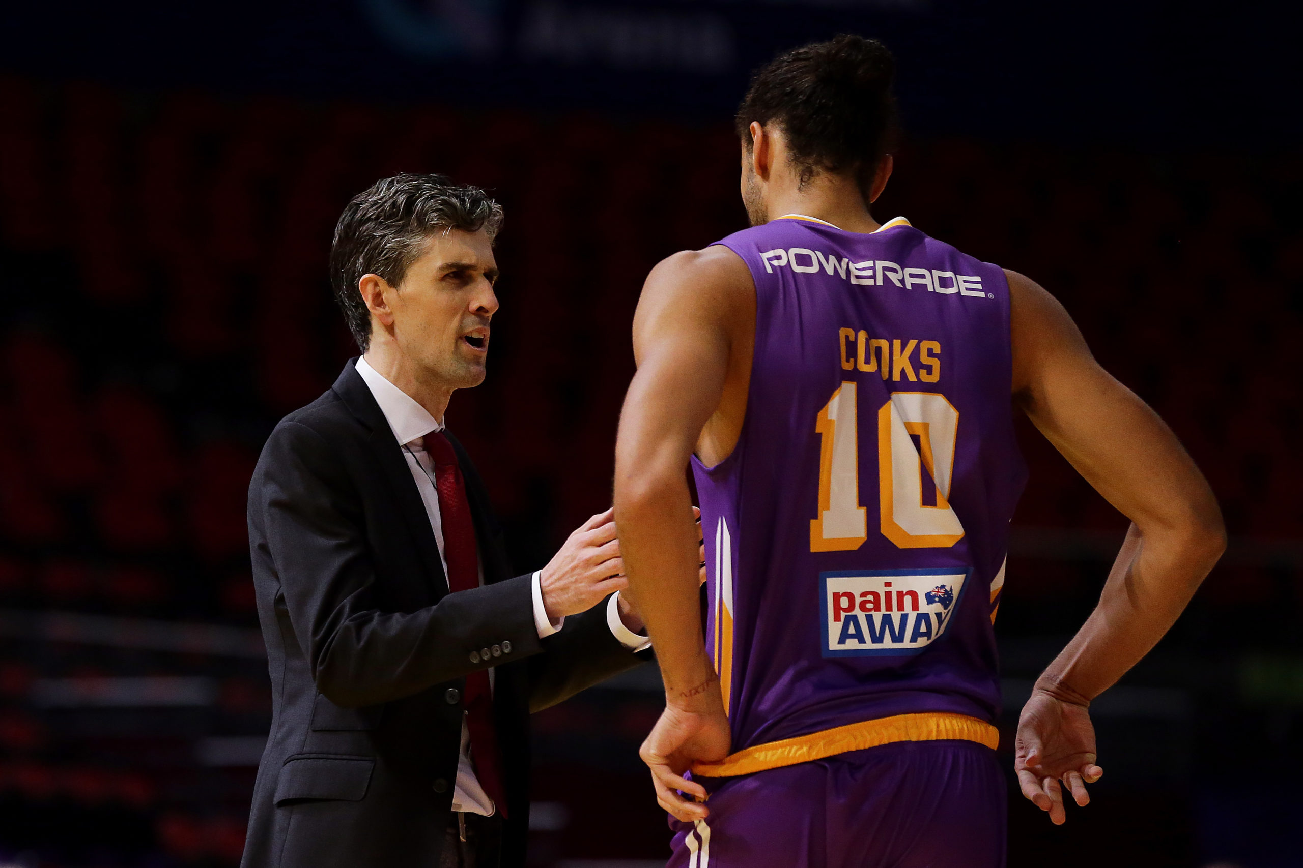 SYDNEY, AUSTRALIA - MARCH 15: Will Weaver, coach of there Kings speaks with Xavier Cooks of the Kings during game three of the NBL Grand Final series between the Sydney Kings and Perth Wildcats at Qudos Bank Arena on March 15, 2020 in Sydney, Australia. (Photo by Will Russell/Getty Images)