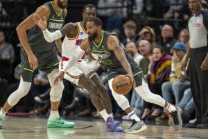 Mike Conley supera a Dennis Schröder