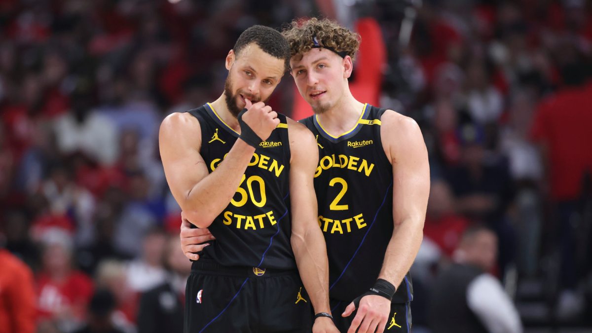 Brandin Podziemski y Stephen Curry.